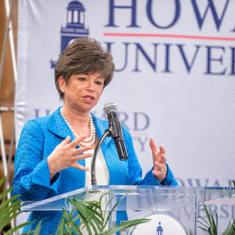 A speaker giving policy and research related speech at the Howard University HBCU center.